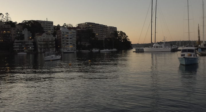 Video still of boats on water at dusk, shot on GoPro Mission 1 Pro.