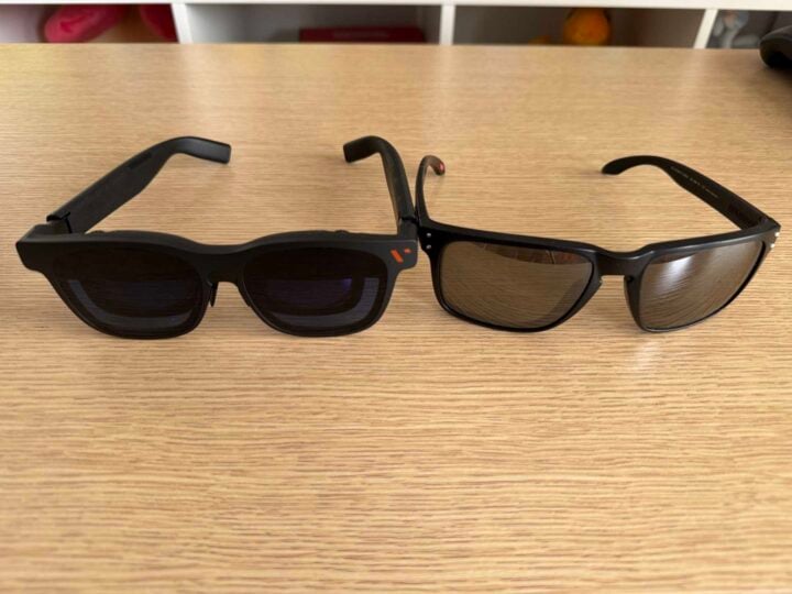 Two sets of glasses on a wooden desk