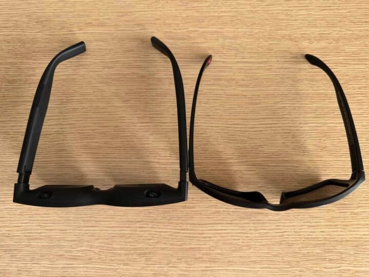Two sets of glasses on a wooden desk photographed at a high angle