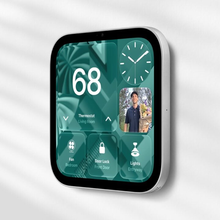 Wall-mounted Apple HomeView showing thermostat, door lock and lighting controls alongside a doorbell camera feed